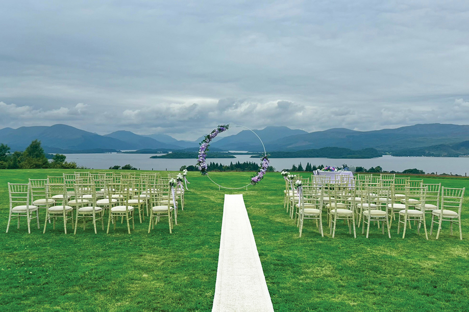 Outdoor wedding ceremony at Ardoch Loch Lomond with waterside views